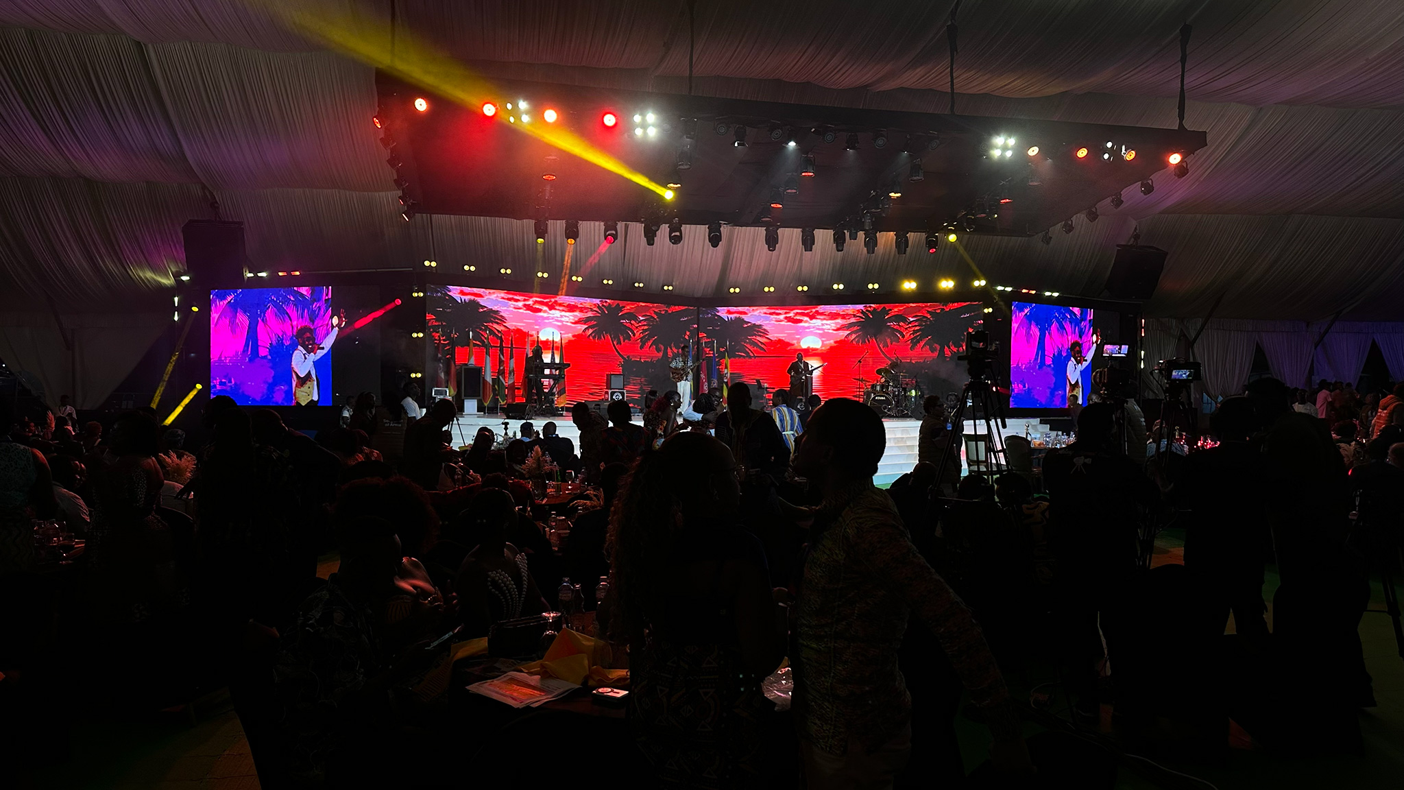 Conference banquet stage with LED screens and concert lighting