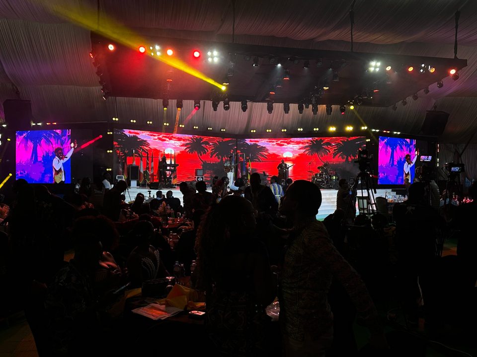 Conference banquet stage with LED screens and concert lighting